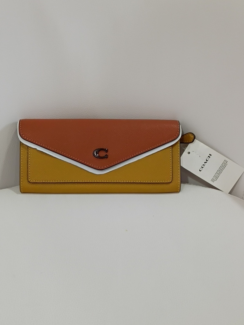 Coach Wyn Cross-grain Leather Envelope Wallet in Rust Brown & Mustard